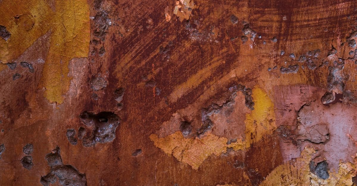 Close-up of a heavily corroded metal surface, the iron oxide that citrate holds in solution