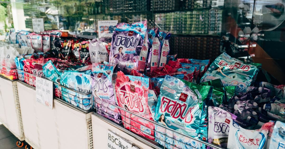 Rows of household cleaning and detergent boxes on a retail shelf