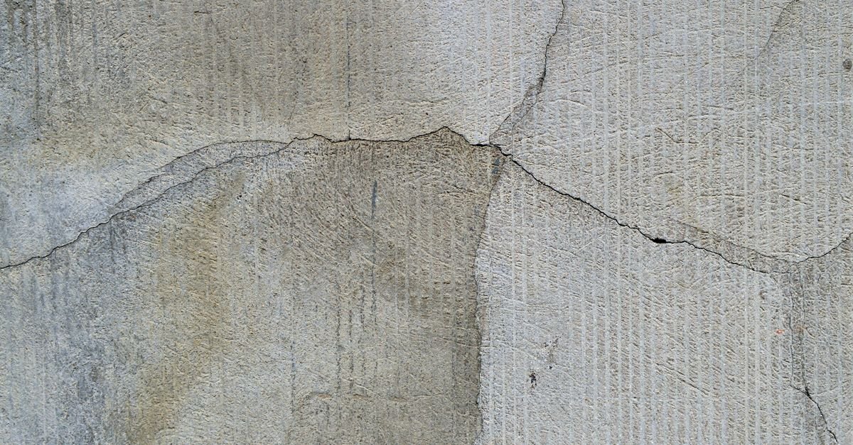 Cracked concrete surface that should be inspected before pressure washing
