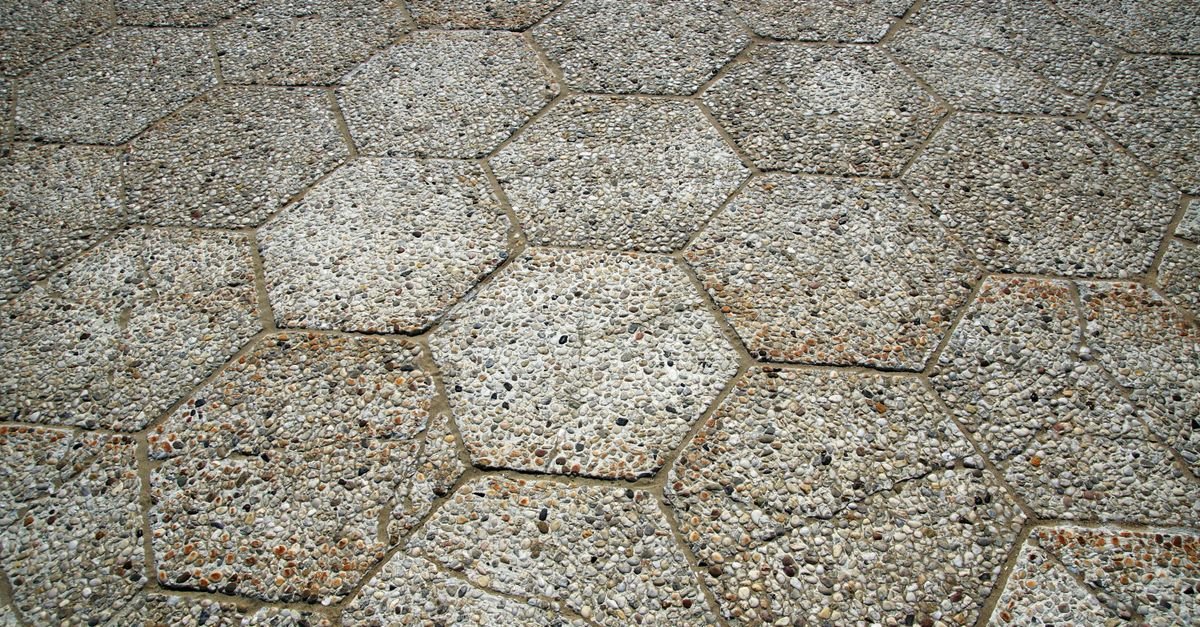 Hexagonal exposed-aggregate concrete pavers with visible joint lines