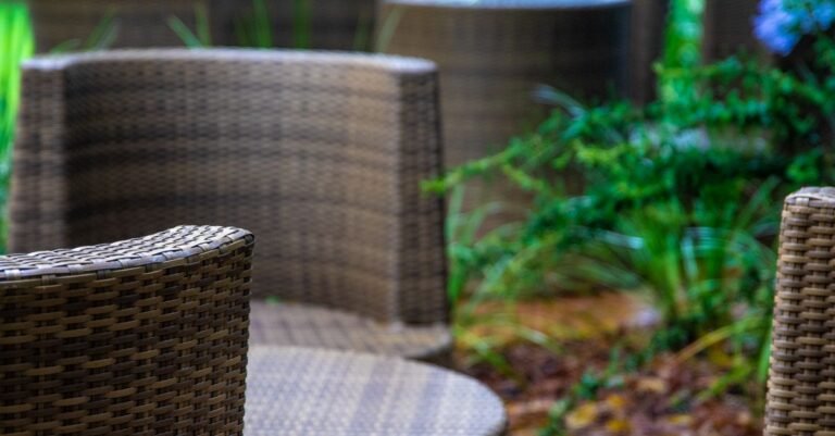 Close-up of woven synthetic resin wicker patio chairs