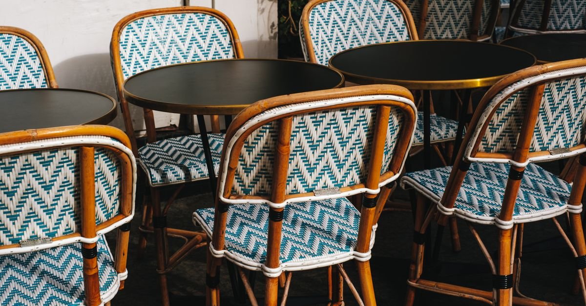 Rattan chairs in bright sunlight showing the tight weave where mildew hides between strands