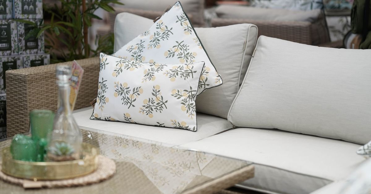 Patterned outdoor seat cushions on a patio chair, where mildew usually starts in the foam core
