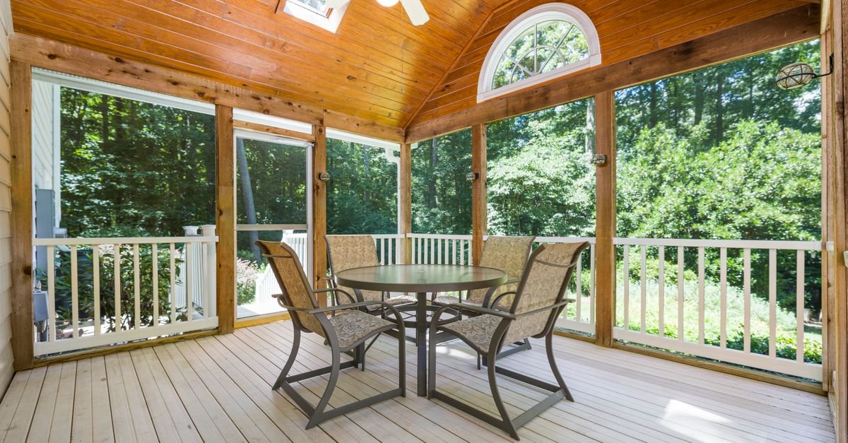 Covered porch with a stained timber ceiling and open garden view