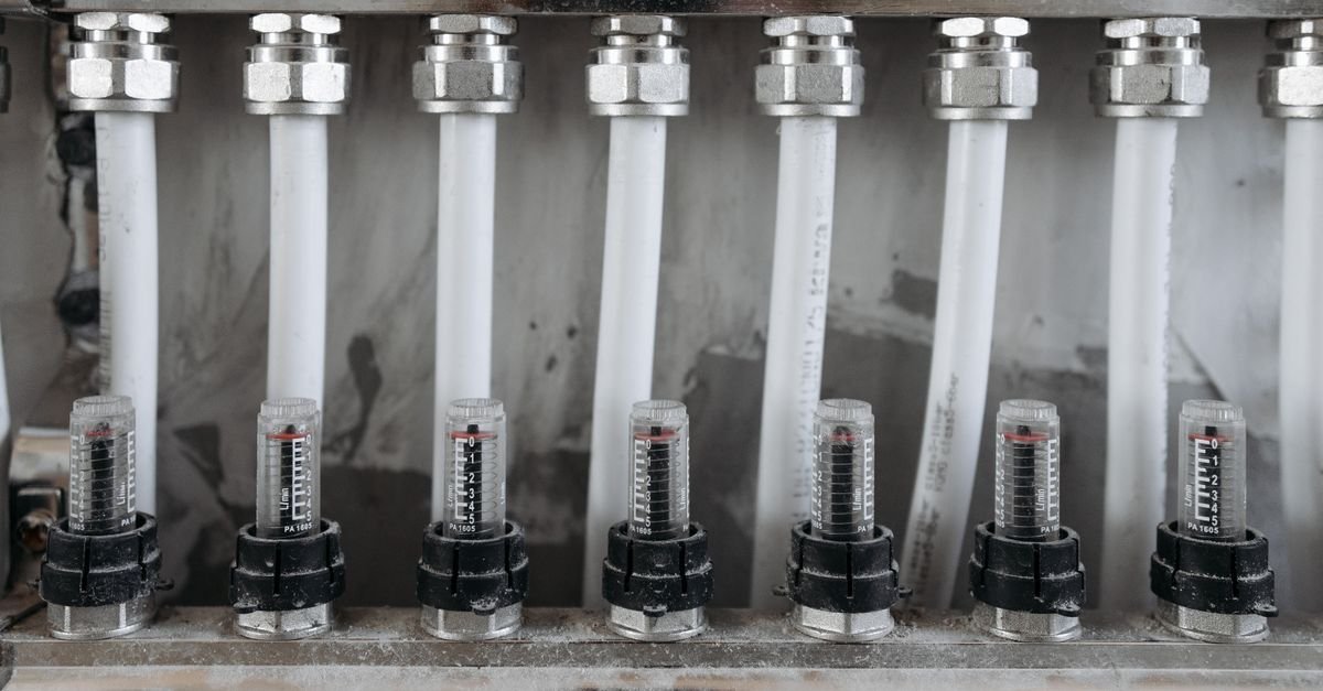 Network of threaded pipe joints and valve bodies in a metal framework, each connection a place a pressurised system can weep