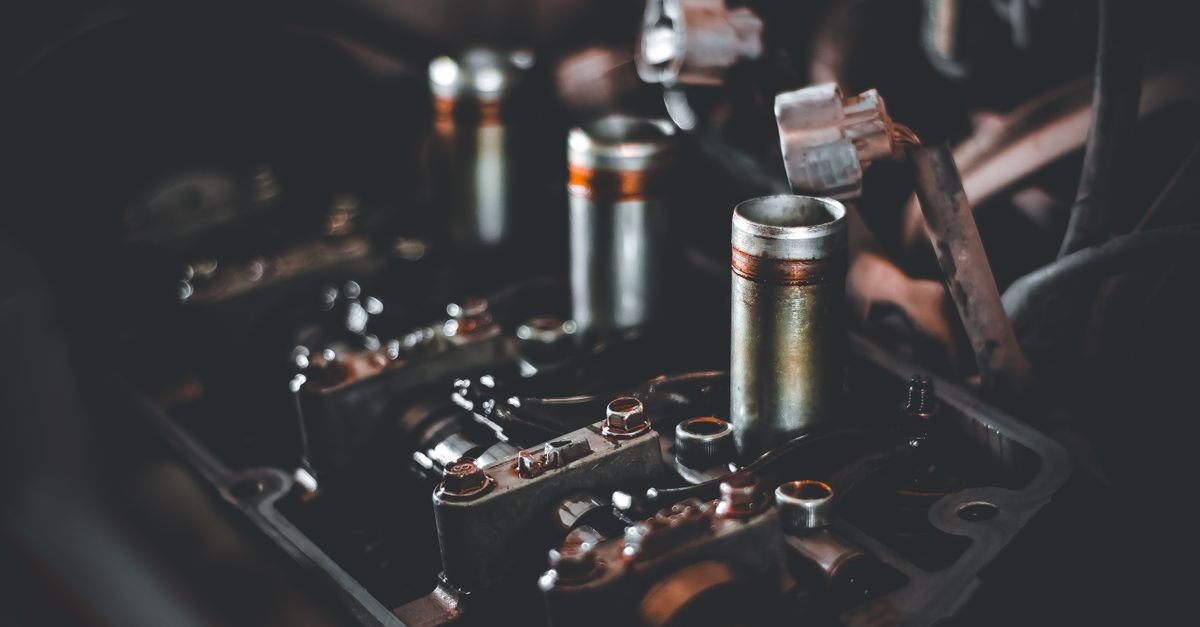 Close-up of an engine camshaft and cylinder head, the assembly that carries a decompression lobe on engines fitted with one