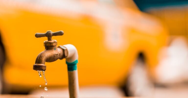Water beading on a brass hose fitting where a worn O-ring has started to weep