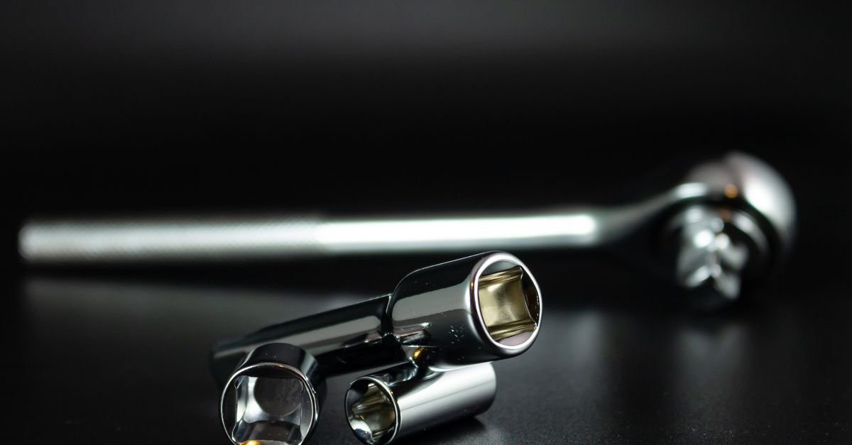 A set of chrome socket wrenches laid out, the tools needed to check pump manifold bolts