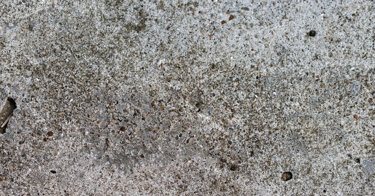 An eroded concrete surface with the sand and aggregate standing proud of the worn paste