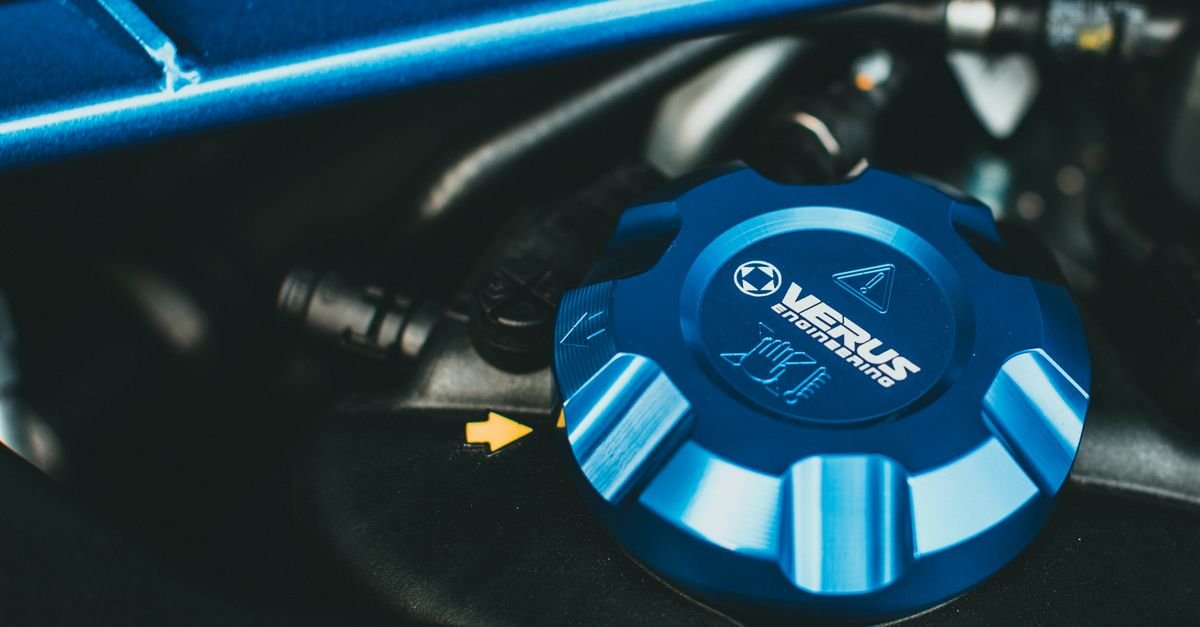 Close-up of an engine oil filler cap, the point where grade and quantity are decided