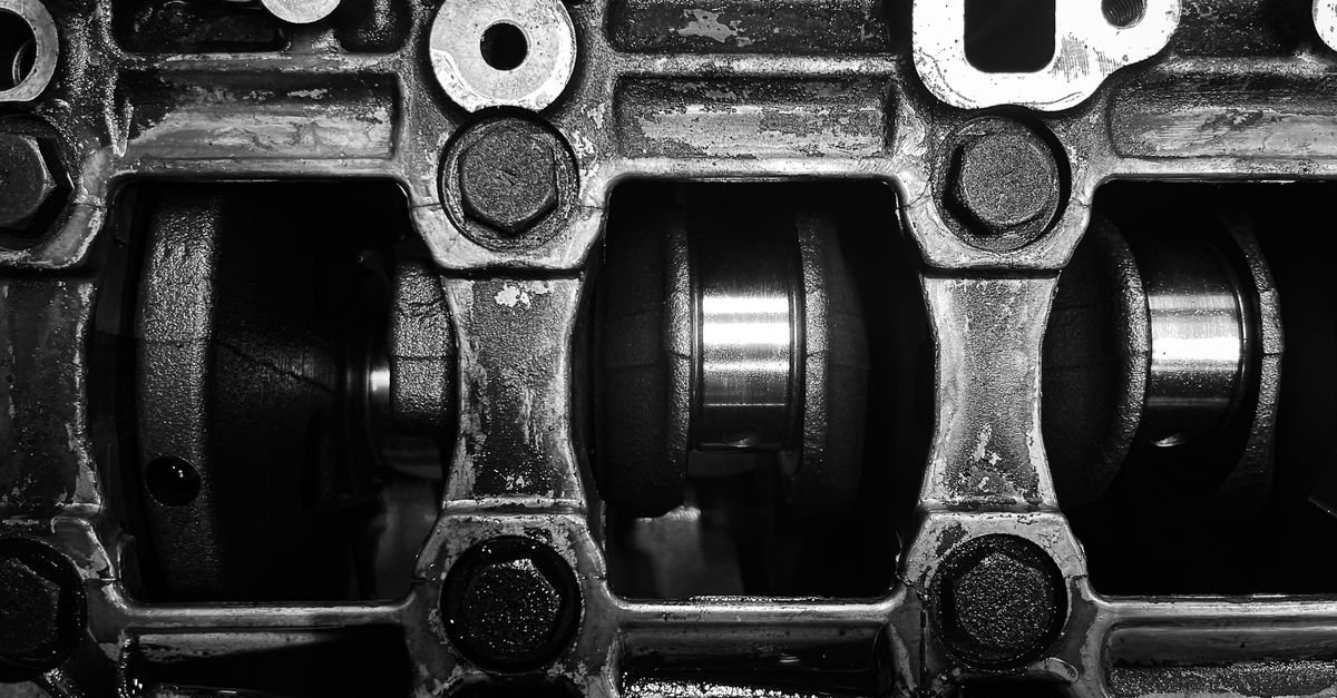 Black and white close-up of an engine crankshaft, the drive arrangement a triplex plunger pump uses to move three plungers in sequence