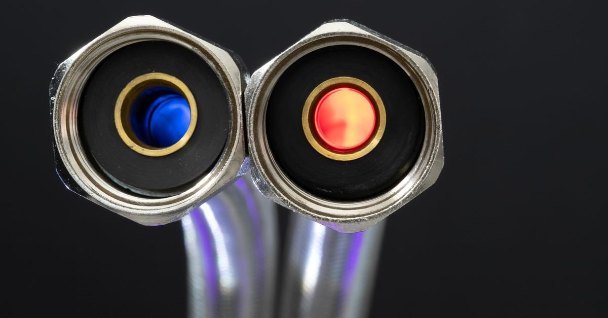 Close-up of chrome hose couplers showing the sleeve collar and locking groove on the male fittings
