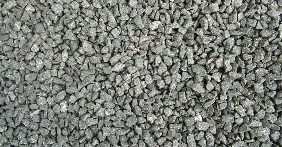 Grey construction gravel of mixed sizes filling the frame