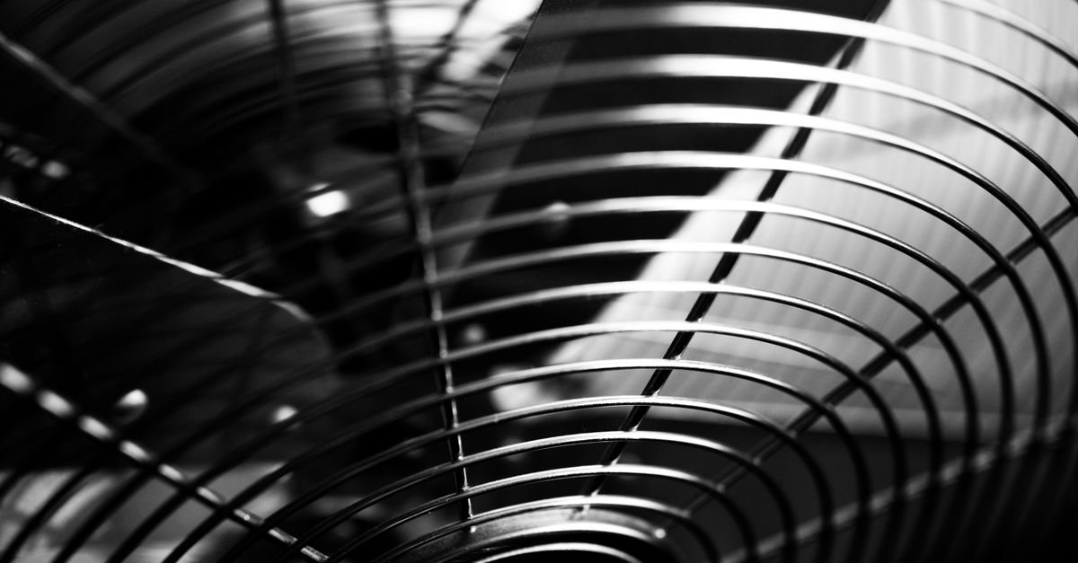 Black and white macro shot of industrial fan blades, the kind of balanced rotating vane set that shakes an entire machine once a single blade is damaged