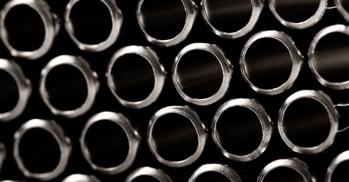 Metallic tubes viewed end-on, their circular bores showing the narrow passage a lance carries water through
