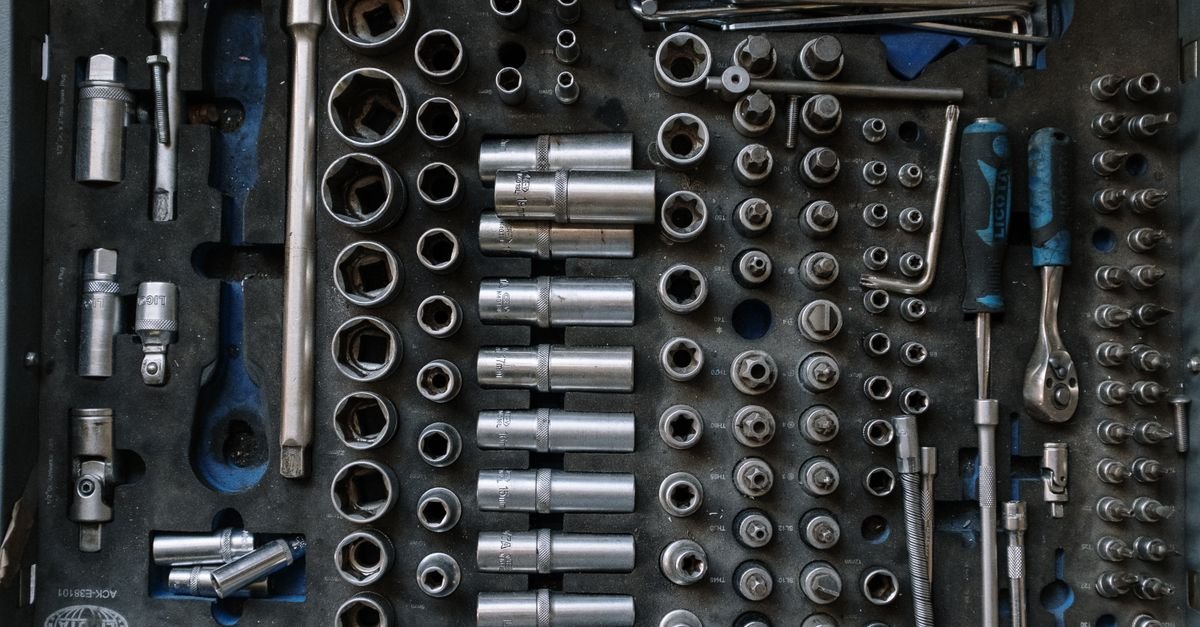 A complete hand tool set laid out flat on a workshop surface