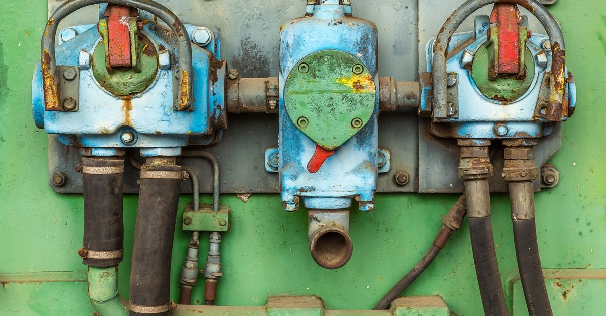 Corroded industrial valves and pipework showing the pitting and cracking that ends a pump's working life
