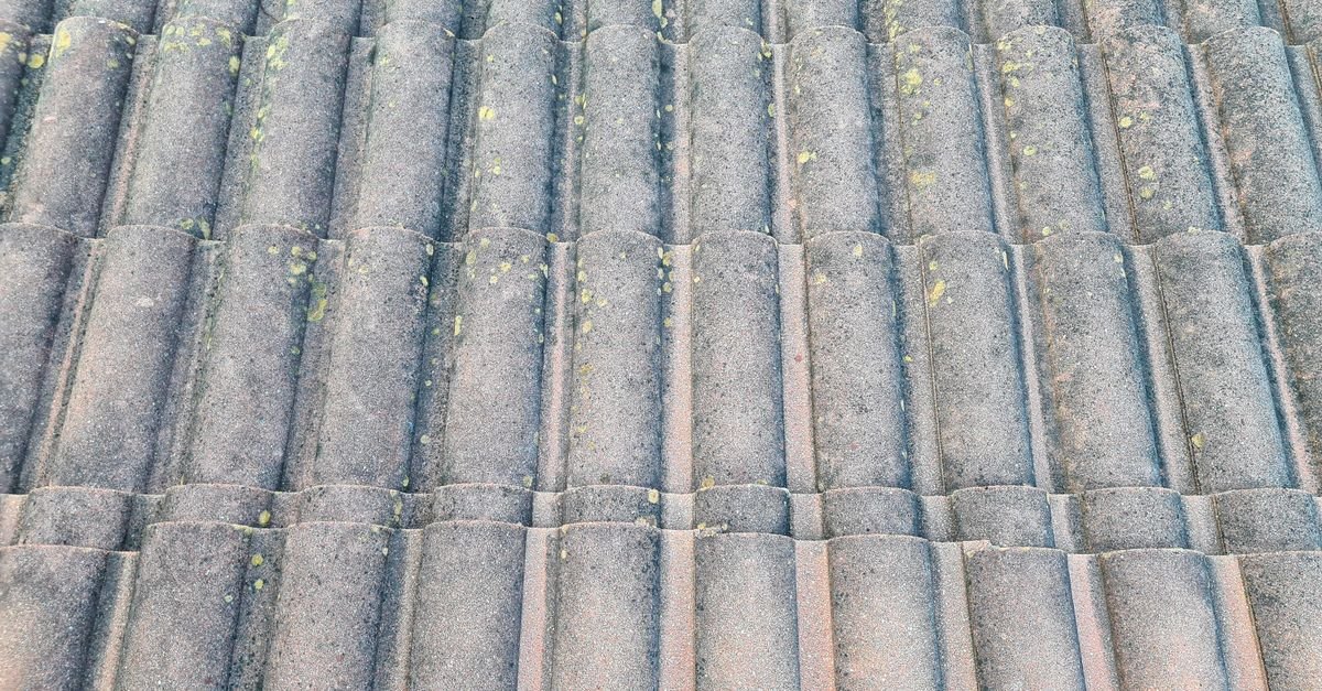 Close-up of textured concrete roof tiles, porous cast tiles finished with a pigmented surface coat