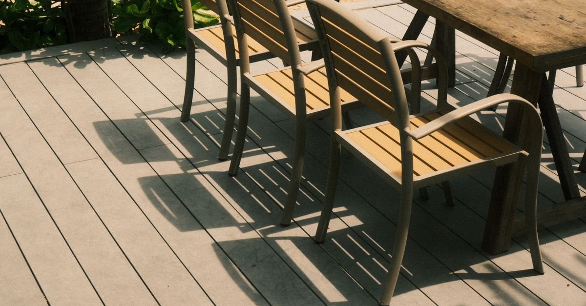 Close-up of composite deck boards showing the embossed grain pattern that sets cleaning direction